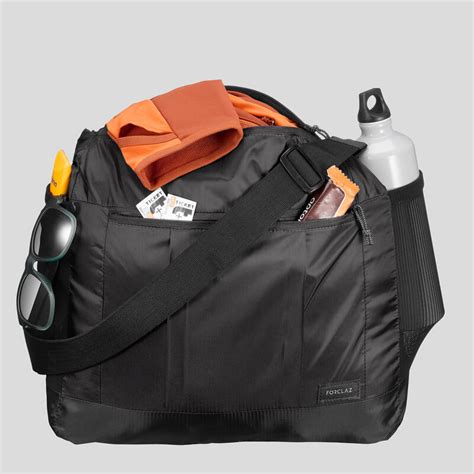 Besace compacte de trek voyage TRAVEL 15L noire .